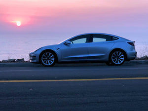 Silver Tesla Model 3 at Sunset